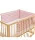 protector de cuna - Vista de uso con modelo pink island